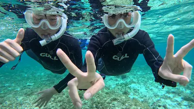 Kids snorkeling in the shallow waters of Ishigaki island